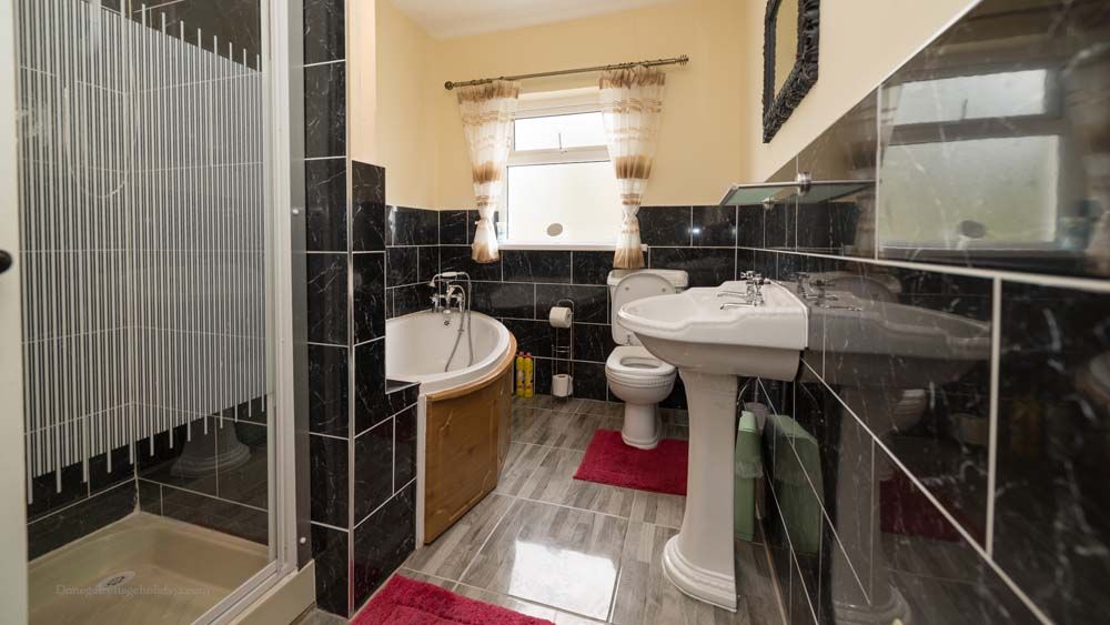 Bathroom with bath and shower